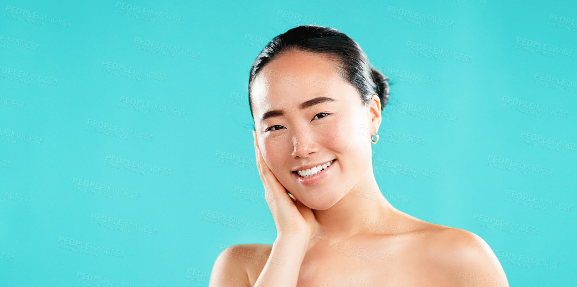 Buy stock photo Happy, skincare and portrait of Asian woman in studio for wellness, cosmetics and facial treatment. Dermatology, mockup space and person for healthy skin, salon and beauty results on blue background