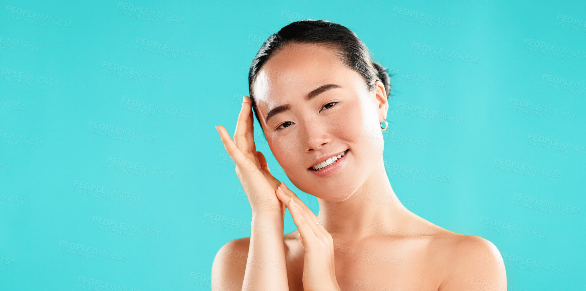 Buy stock photo Beauty, skincare and portrait of Asian woman on blue background for wellness, cosmetics and facial treatment. Dermatology, mockup space and person for healthy skin, salon and spa benefits in studio