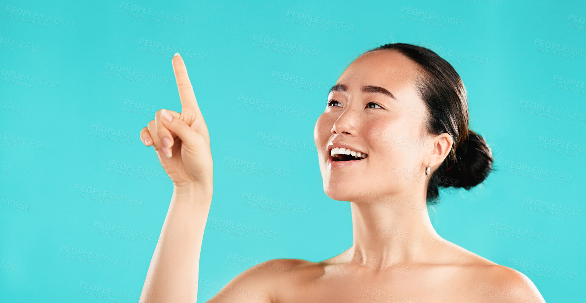 Buy stock photo Beauty, skincare and Asian woman in studio pointing for choice for cosmetics, wellness and facial treatment. Dermatology, spa and girl with gesture for health, grooming or decision on blue background