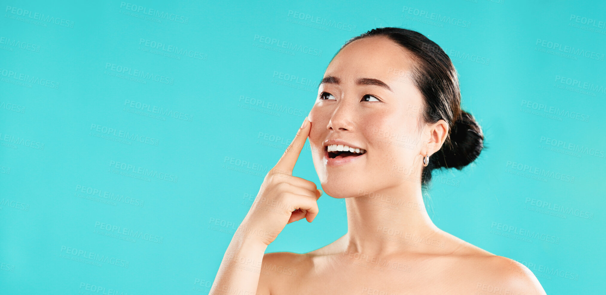 Buy stock photo Thinking, skincare and Asian woman in studio for beauty, wellness and facial treatment choice. Dermatology, mockup space and person with gesture for health, cosmetics and decision on blue background
