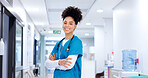 Crossed arms, woman and portrait of nurse in hospital with confidence for healthcare career. Happy, pride and face of professional female medical worker in hallway for nursing job with help in clinic
