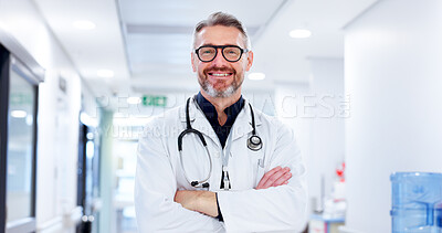 Buy stock photo Arms crossed, doctor and portrait of man in hospital for healthcare or medical appointment. Cardiology, experience and trust with mature medicine professional in clinic for consulting or diagnosis