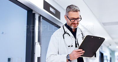 Buy stock photo Man, doctor and clipboard in hospital for schedule, surgery planning and healthcare checklist. Paperwork, form or mature surgeon with documents for insurance information, medical aid or prescription