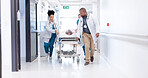 Running, hospital and doctors with bed for emergency, surgery and help for medical service. Healthcare, er and people rush with stretcher for accident, operation or surgical treatment in hallway