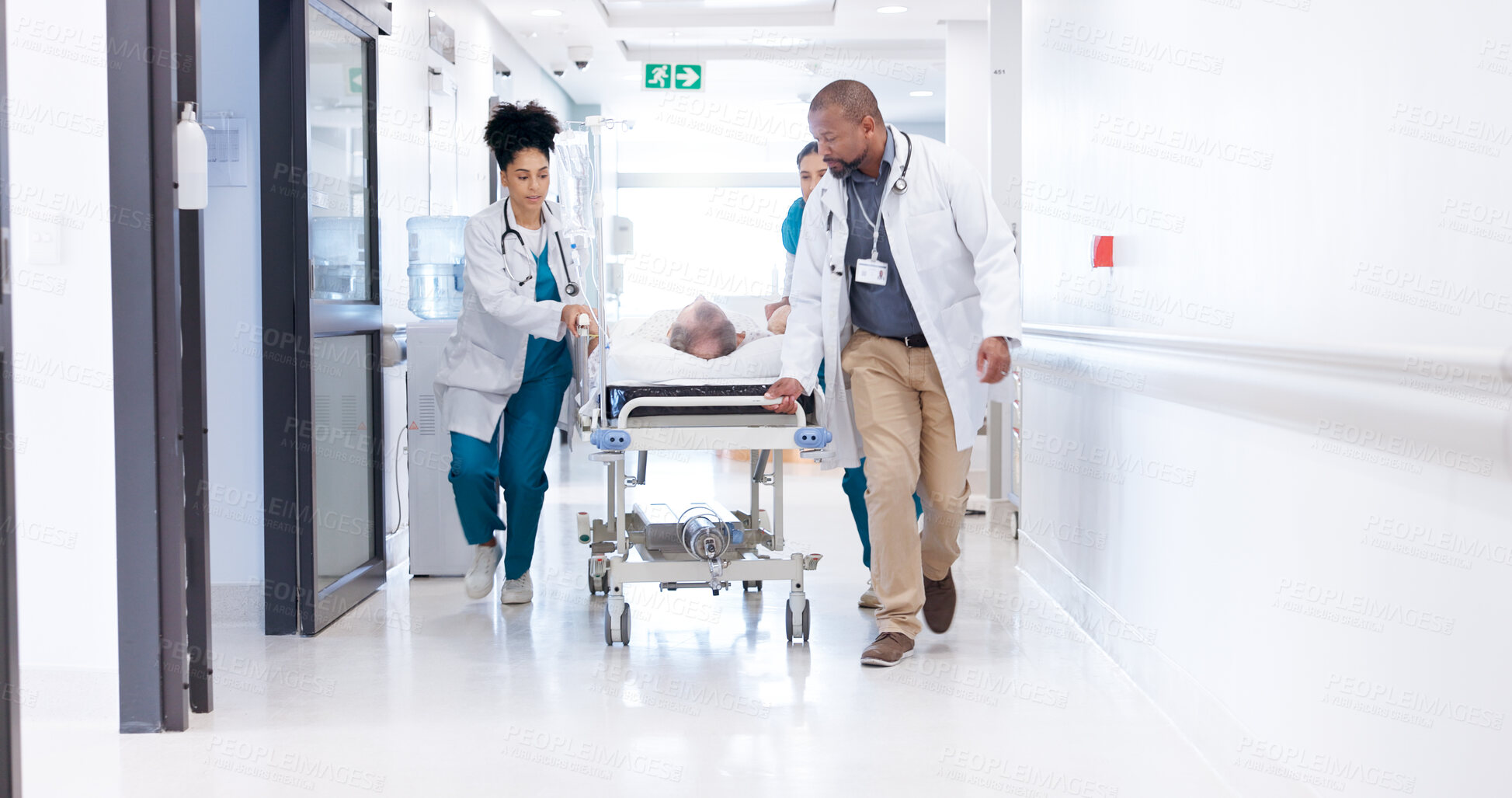Buy stock photo Running, hospital and doctors with bed for emergency, surgery and help for medical service. Healthcare, er and people rush with stretcher for accident, operation or surgical treatment in hallway
