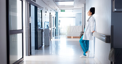 Buy stock photo Doctor, woman and tired in hospital corridor for healthcare crisis, medical burnout or bad news. Health professional, stress and disappointed with clinic loss, medicine fail or overwhelmed in hallway