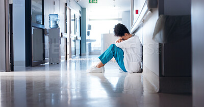 Buy stock photo Doctor, woman and stress on hospital floor for healthcare crisis, medical challenge and bad news. Professional, tired and grief with clinic loss, medicine fail or overwhelmed by burnout in corridor