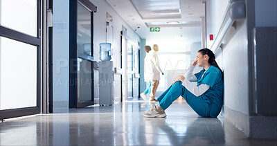 Buy stock photo Nurse, woman and sad on hospital floor for healthcare crisis, surgery fail and bad news. Health professional, emotional and stress for clinic loss, medicine mistake and overwhelmed with medical doubt