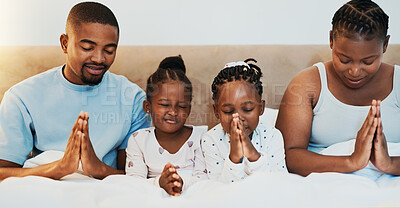Buy stock photo Worship, support and prayer with black family in bed for trust, spiritual and morning bonding. Love, God and christian faith with parents and children at home for religion, gratitude and catholic