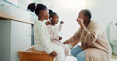 Buy stock photo Mother, children and brushing teeth in dental hygiene, morning routine or healthcare together in bathroom. Happy mom, daughters and cleaning mouth in tooth whitening, oral or gum care at home