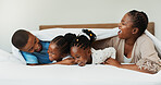 Laughing, tickle and smile with black family in bedroom  at morning for cuddle, funny and bonding together. Happiness, comedy and playful with parents and children at home for love, wake up and care