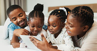 Buy stock photo Happy black family, tablet and relax in bedroom in home, streaming movie or watch cartoon with parents. Mother, father and kids with digital technology for bonding, show or storytelling with ebook