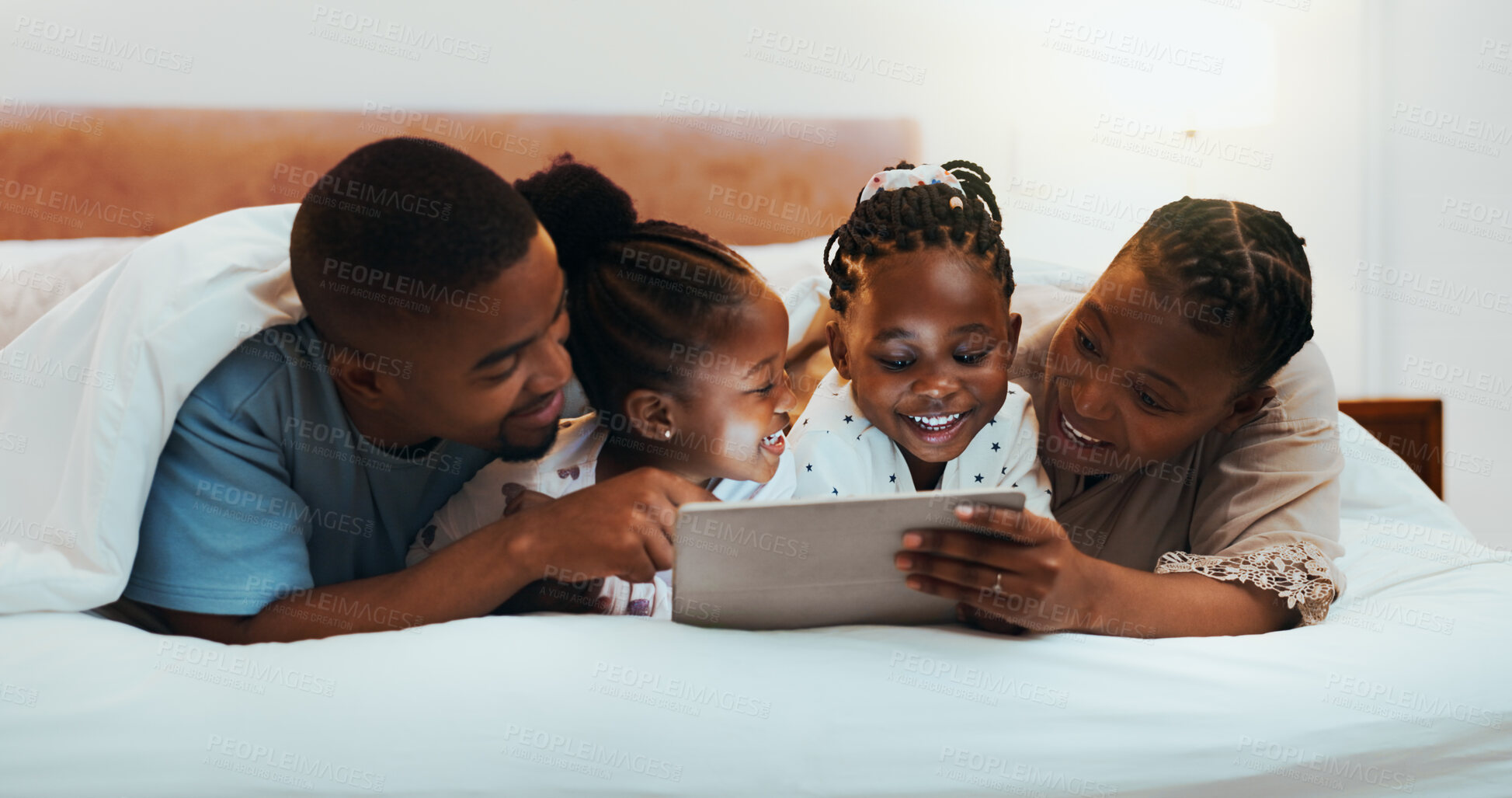 Buy stock photo Black family, tablet and parents with kids in bedroom, streaming movie or watch cartoon in home. Mother, father and children with digital technology for relax, smile or storytelling with ebook online