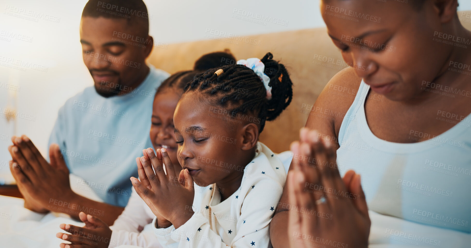 Buy stock photo Worship, relax and prayer with black family in bed for trust, spiritual morning and bonding. Support, God and christian faith with parents and children at home for religion, gratitude and catholic