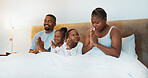 Worship, religion and morning prayer with black family in bed for trust, spiritual and bonding. Love, God and christian faith with parents and children at home for support, gratitude and catholic