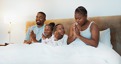 Buy stock photo Love, prayer and faith with black family at home at morning for trust, spiritual and bonding. Happiness, relax and wake up with parents and children in bedroom for support, gratitude and hope