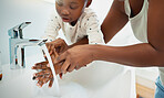 Hygiene, helping and black mom with child for washing hands in bathroom for learning. Happy, teaching and African mother with girl for cleaning skin for prevention of bacteria, dirt or dust in home.