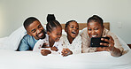 Love, selfie and relax with black family in bedroom for photography, social media and post. Bonding, picture update and happiness with parents and children at home for memory, online and connection