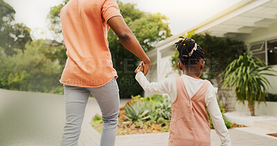 Buy stock photo Outdoor, black family and child with holding hands for walking, connection and bonding together. Back, people and father with kid for security, support and relationship on weekend in property