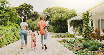 Buy stock photo Outdoor, black family and parents with children for walking, connection and bonding together by house. Back, mom and dad with kids for holding hands, carrying and relationship on weekend in property
