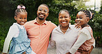 Outdoor, black family and hug with children in portrait, carrying and bonding together with smile. Father, mother and kids in nature for holiday, weekend fun and love with connection for happiness