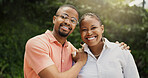 Outdoor, black couple and portrait with hug for love, connection and bonding together in marriage. Nature, man and woman with happiness for commitment, affection and support in healthy relationship