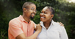 Outdoor, black couple and smile with hug for love, connection and bonding together in marriage. Nature, man and woman with happiness for commitment, affection and support in healthy relationship