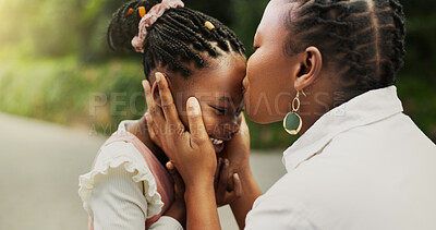 Buy stock photo Kiss, bonding and black mother with daughter in park for support, trust and smile. Embrace, happiness and love with woman and girl on family trip outdoor for peace, comfort and affectionate together
