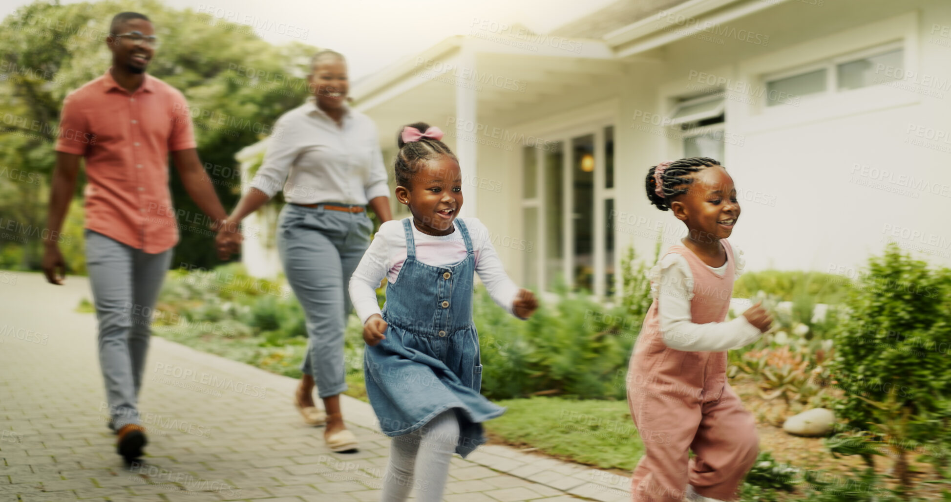 Buy stock photo Outdoor, black family and parents with children for running, playful and bonding together by house. Holding hands, mom and dad with kids for walking, happiness and relationship on weekend in property