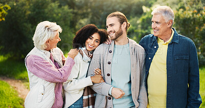 Buy stock photo Happy couple, hug or senior parents in park for bonding with love, interracial relationship or care in retirement. People, mature mother and father with family support in nature on holiday vacation