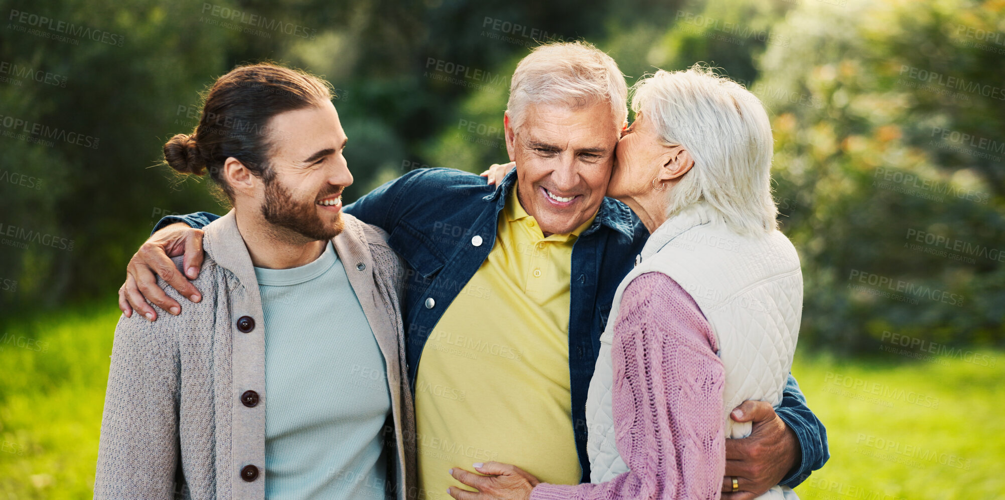 Buy stock photo Hug, park and senior parents with son for bonding, relationship and relax together. Nature, happy family and elderly father, mother and man embrace outdoors for love, affection and care on weekend
