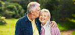 Kiss, happy and old couple in park for support, commitment and relax together outdoors in morning. Retirement, nature and senior man and woman laugh embrace for bonding, relationship or romance