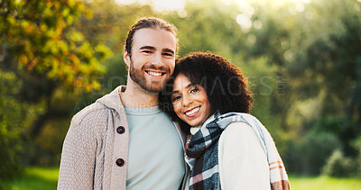 Buy stock photo Portrait, happy and couple hug in park for support, love and affection outdoors in morning. Interracial, nature and man and woman embrace for bonding, relationship and romance together in garden