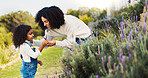 Outdoor, lavender and mother with girl, plants and environment with spring, countryside and love. Family, parent and mama with daughter, flowers and scent with growth, bonding together or floral care