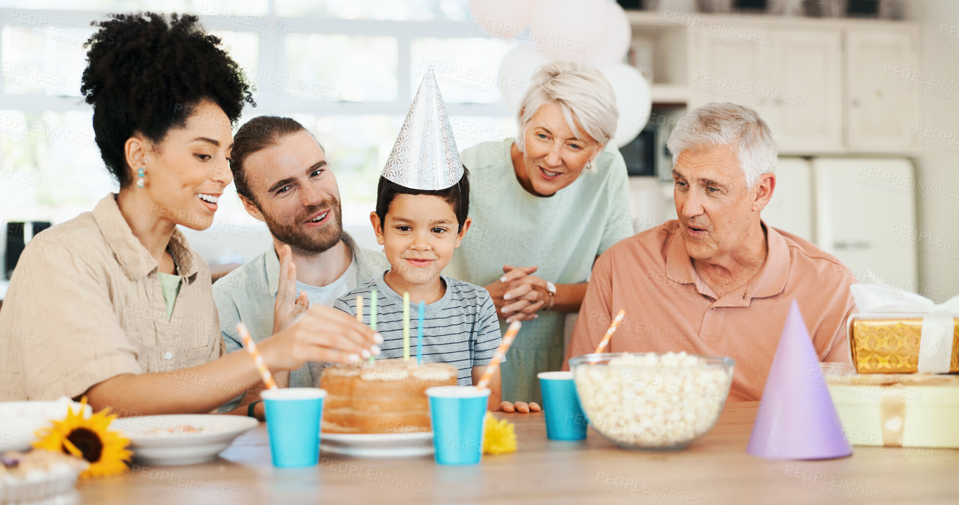 Buy stock photo Birthday, cake and child with parents and grandparents for lunch party, celebration and event together. Big family, happy and boy, mom and dad with dessert, candles and food for surprise in house