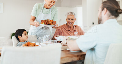 Buy stock photo Love, chicken and lunch with big family in dining room for bonding, food and nutrition. Support, happiness and grandparents with child and parents eating at home for relax,  serving and health