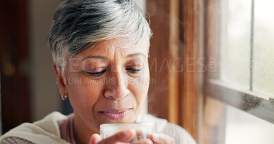 Buy stock photo Senior woman, relax and coffee at house with hot beverage, calm morning and weekend break by window. Elderly person, herbal drink and resting with peace, comfort and cozy aroma of retirement wellness