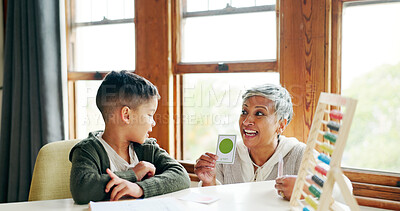 Buy stock photo Home, teaching and grandma with child, maths and card with color of abacus, growth and development. Happy, senior woman and studying for education, student and learning with elderly person in house