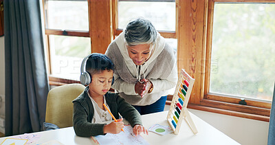 Buy stock photo Writing, woman and child with headphones, education and listening to podcast for knowledge or abacus. Studying, student and kid with audio for homework, growth and development with grandma or numbers