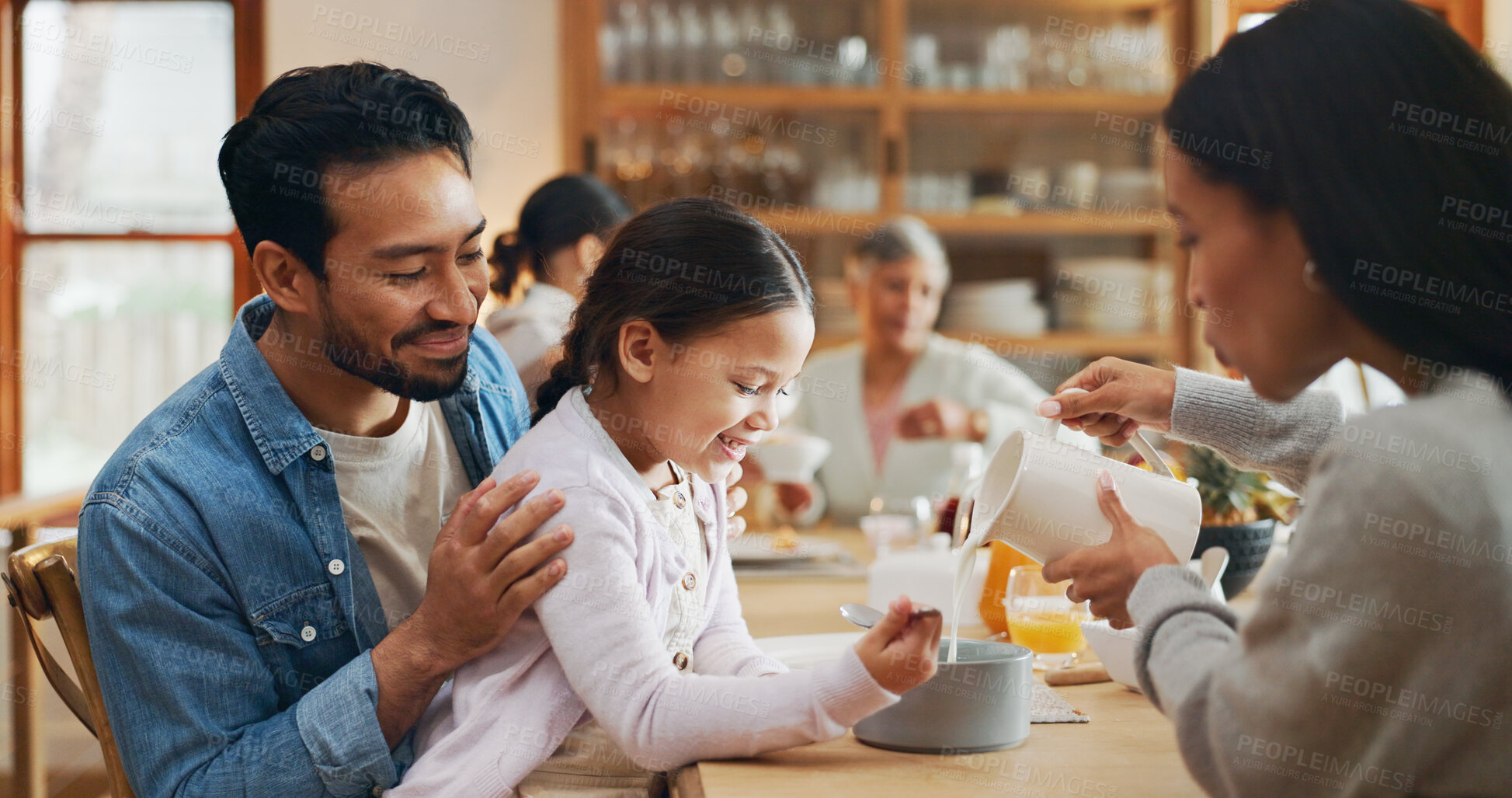 Buy stock photo Family, child and parents with serving breakfast for healthy meal, pouring milk or helping with porridge. Love, home or happy people in dining room for lunch, nutrition and relax with care or support