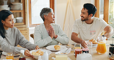 Buy stock photo Breakfast, talking and smile with family at home for bonding, nutrition and croissant food. Morning, wellness and health with people eating in dining room of house for connection, support and brunch
