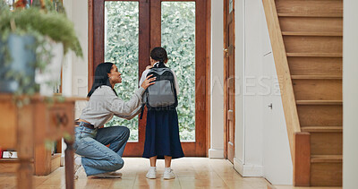 Buy stock photo Mother, girl and backpack for school at front door with motivation, care and love in morning at house. Mom, child and kindness with support for learning, education and scholarship at family home