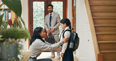 Buy stock photo Parents, girl and backpack for school at front door with motivation, care and love in morning at house. Woman, child and kindness with support for learning, education and scholarship at family home