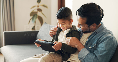 Buy stock photo Home, smile and father with child for tablet, streaming movies and bonding together with technology. Couch, dad and love with boy for digital video, cartoon and watch film on website in living room