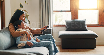 Buy stock photo Hug, watching tv and mother with daughter on sofa for bonding, care and streaming. Movie, happiness and connection with woman and child in living room of family home for commitment, relax or film