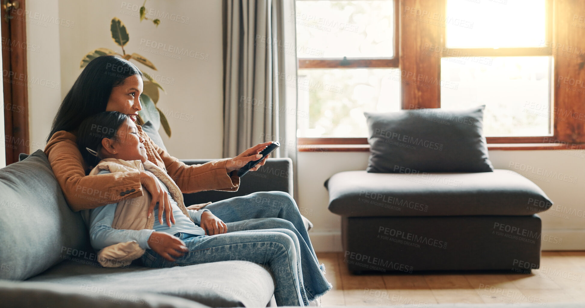 Buy stock photo Hug, watching tv and mother with daughter on sofa for bonding, care and streaming. Movie, happiness and connection with woman and child in living room of family home for commitment, relax or film