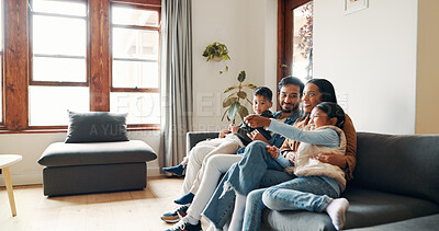 Buy stock photo Relax, watching tv and smile with family on sofa for bonding, show and streaming. Movie, happiness and connection with parents and children in living room of home for commitment, love or film