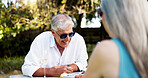 Smile, senior couple and laugh on date with romance, funny joke and partner love for retirement brunch. Happy, elderly people and talk with champagne, anniversary celebration and commitment of picnic