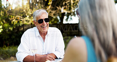 Buy stock photo Happy, senior couple and laugh on date with romance, funny joke and partner love for retirement brunch. Smile, elderly people and talk with champagne, anniversary celebration and commitment at picnic