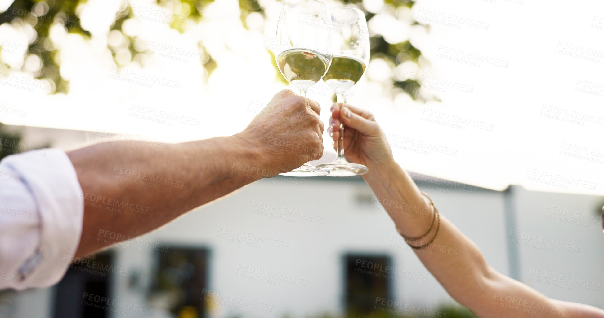 Buy stock photo Hands, people and toast with champagne outdoor on date, romance and celebration of anniversary. Senior couple, cheers and alcohol in glass of marriage commitment, congratulations and bonding at house
